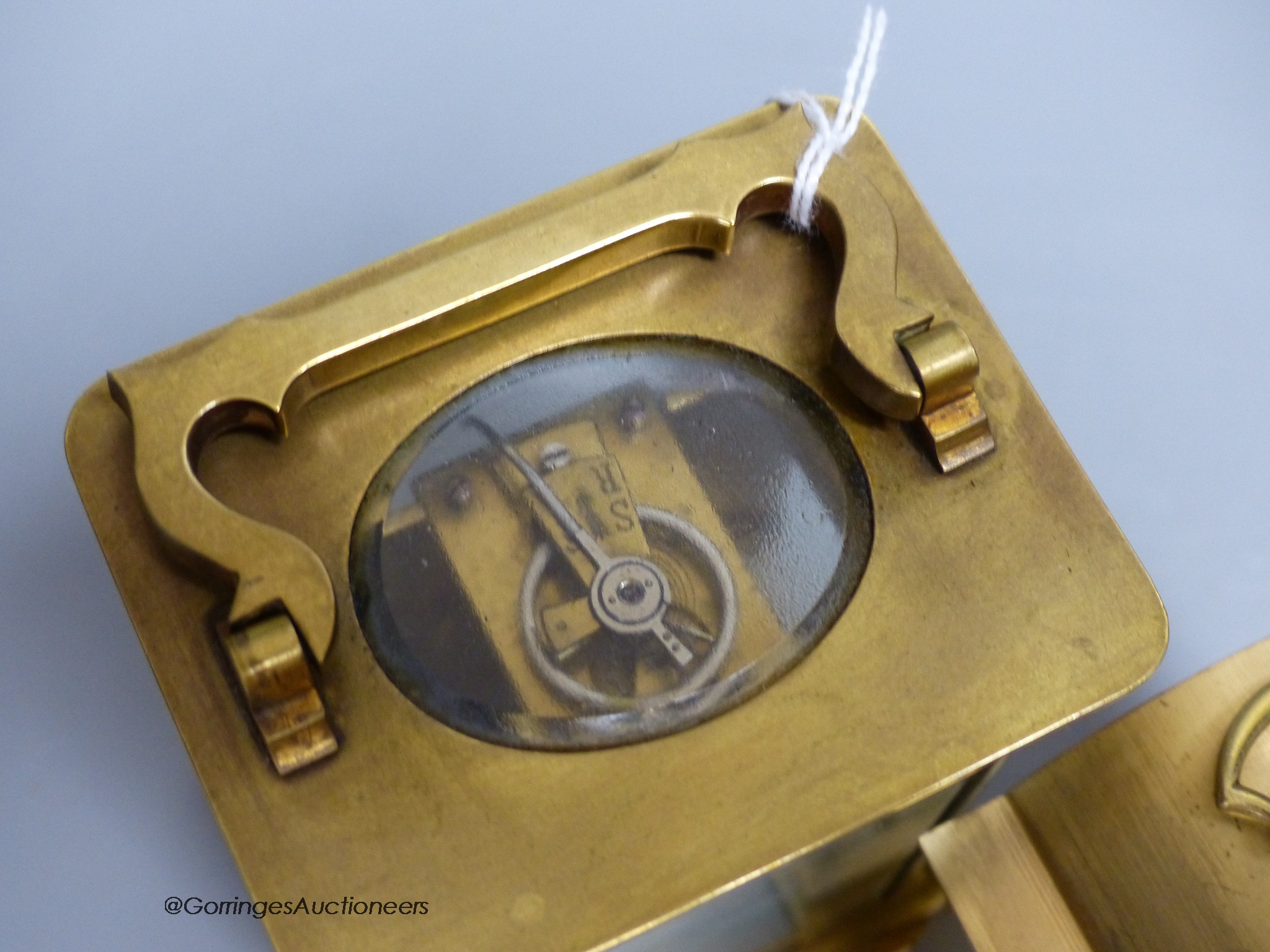 A brass carriage timepiece, 10.5cm and a carriage clock